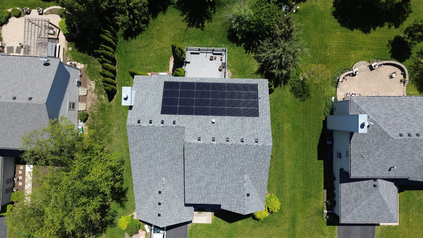 Removal and reinstall in Arlington Heights, IL — bare roof with mounting brackets after solar panels were removed
