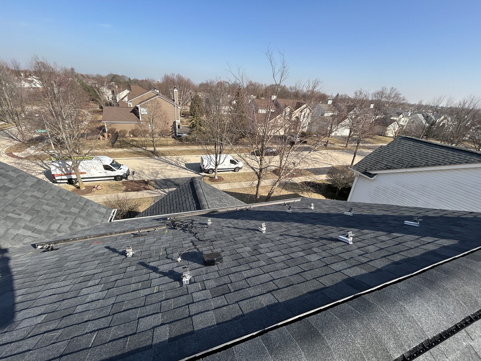 Removal and reinstall in Mount Prospect, IL — racking rails installed on a cleared roof, ready for panels