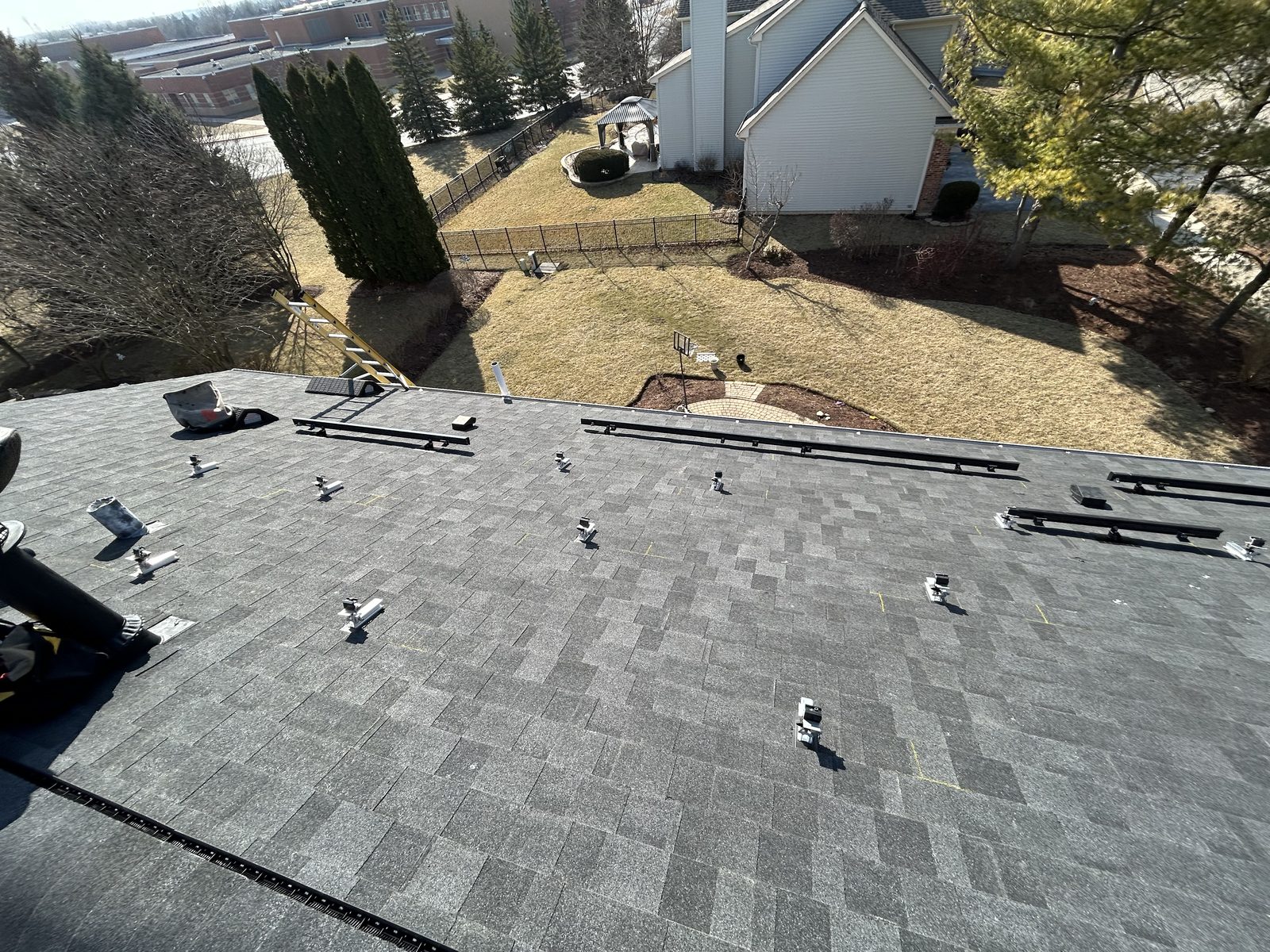 Removal and reinstall in Bolingbrook, IL — racking rails installed on a cleared roof, ready for panels