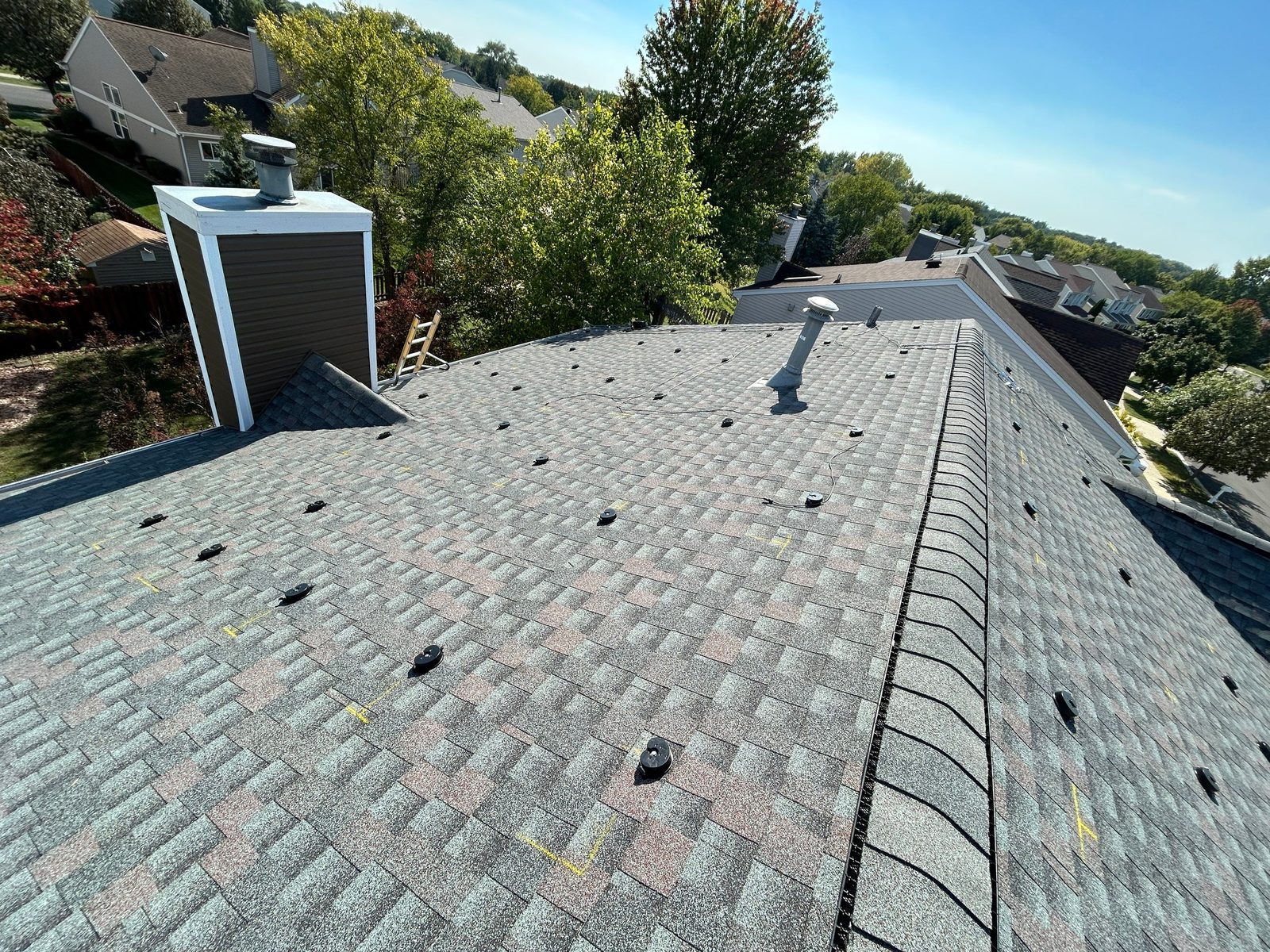 Removal and reinstall in Algonquin, IL — bare roof with mounting brackets after solar panels were removed