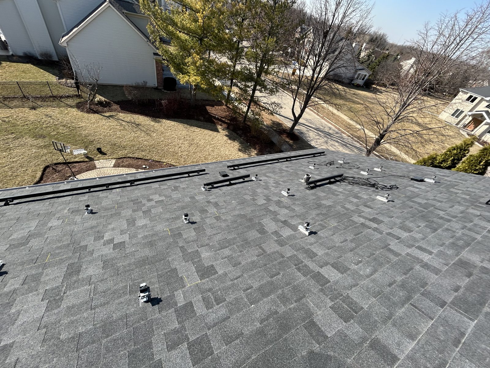 Removal and reinstall in Lake Zurich, IL — racking rails installed on a cleared roof, ready for panels