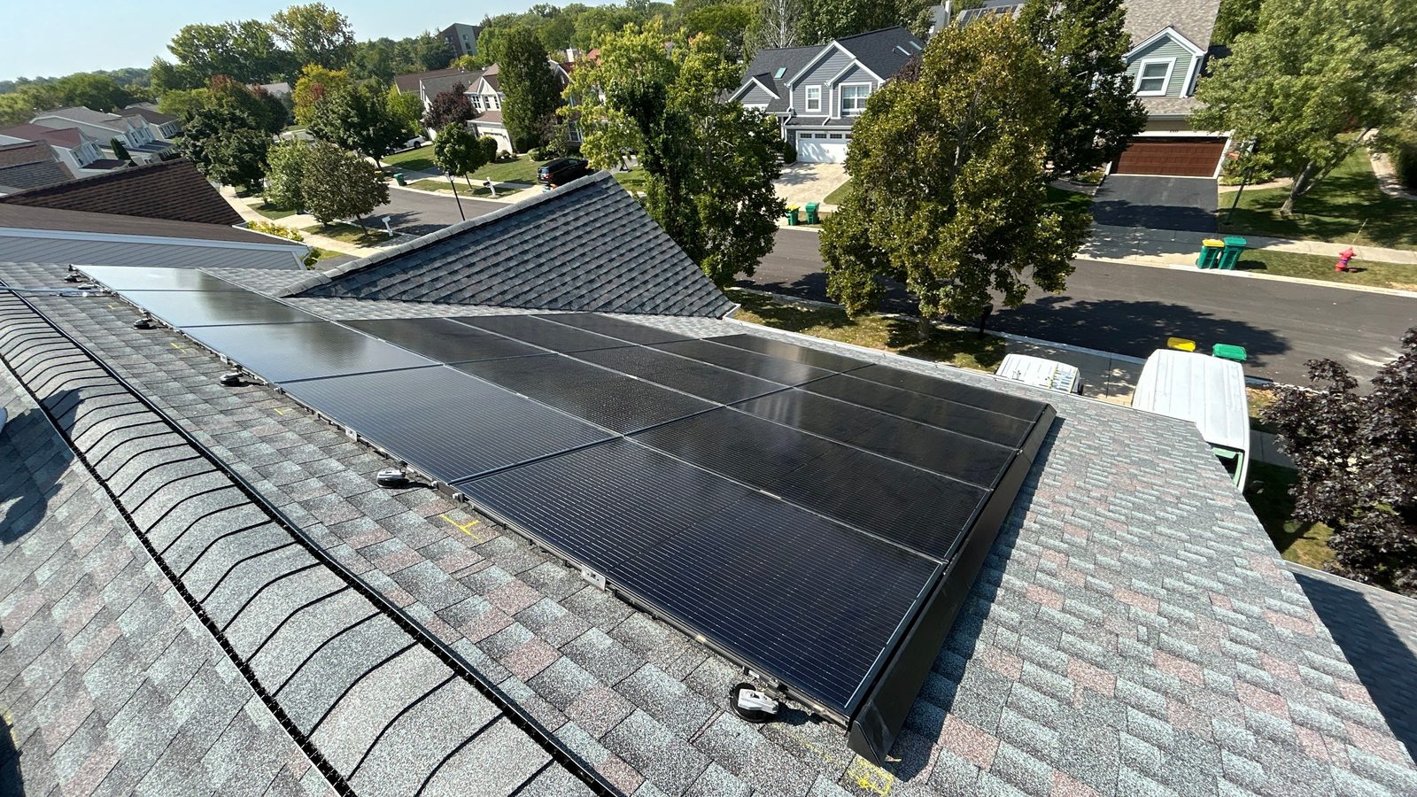 Removal and reinstall in Wheaton, IL — solar panels reinstalled on a completed roof
